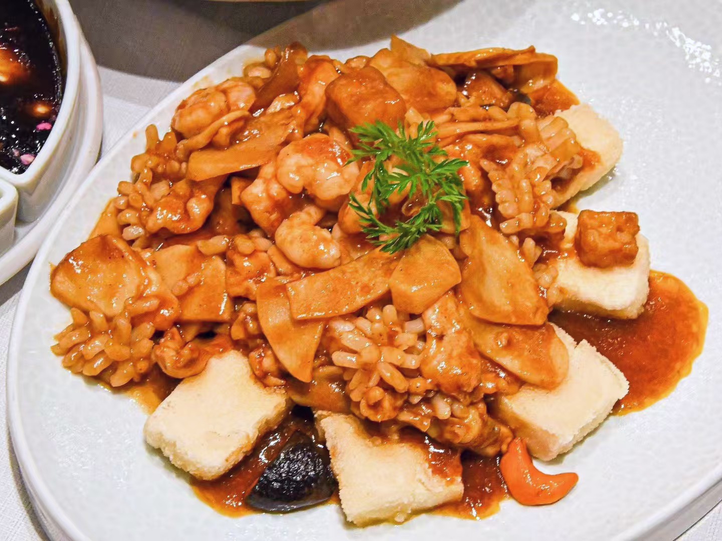 Eight treasure tofu with shrimp peas corn and carrots