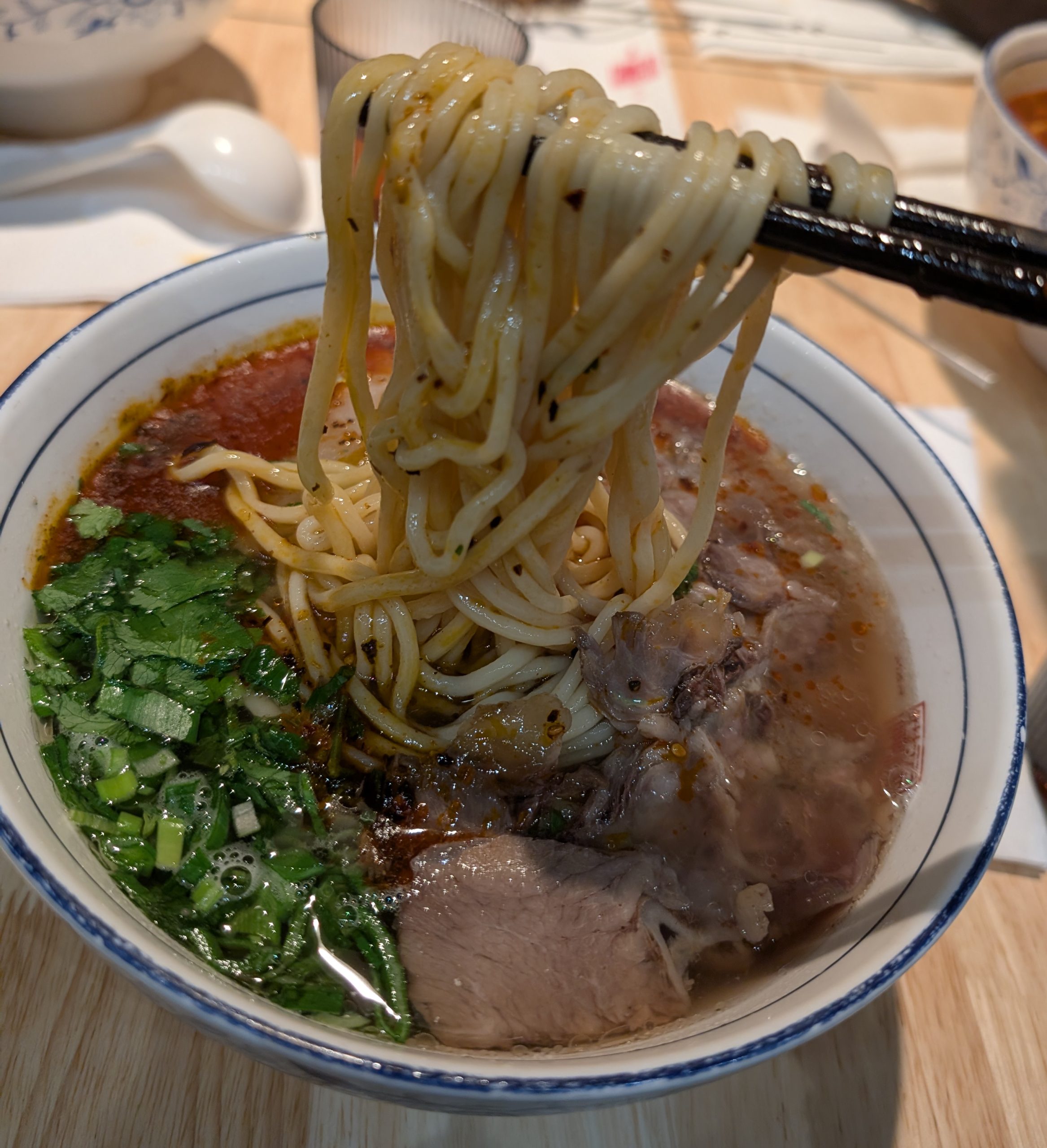 Lanzhou beef lamian noodle soup bowl with clear broth