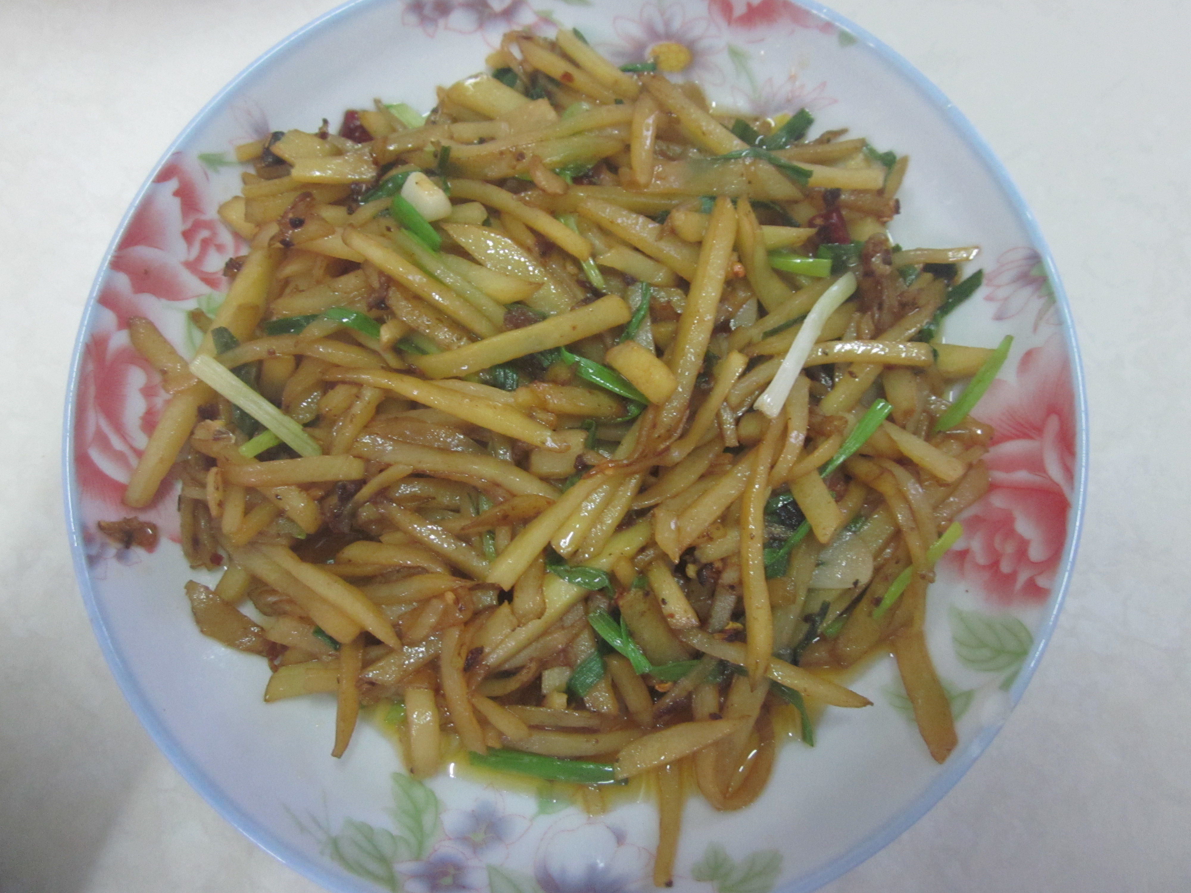 Hot and sour shredded potato Hunan style with dried chilies