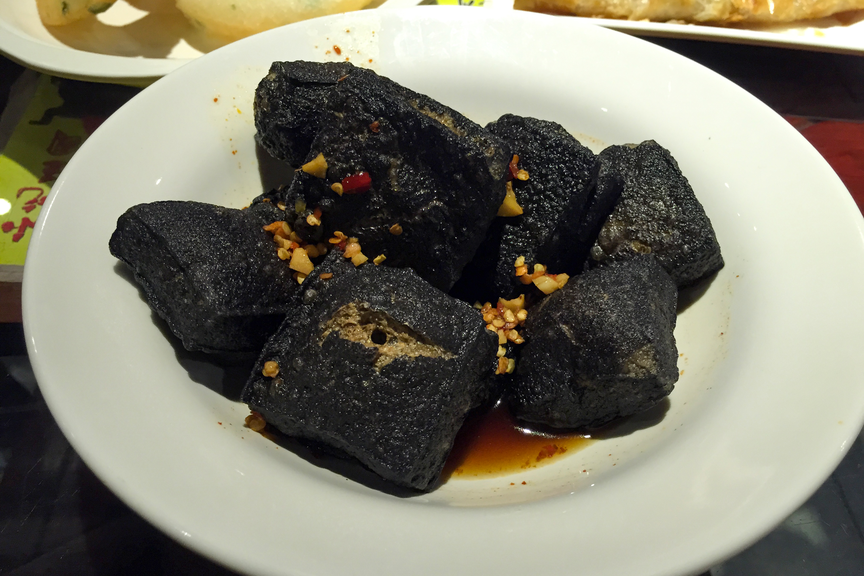 Changsha stinky tofu with pickled chilies and garlic sauce