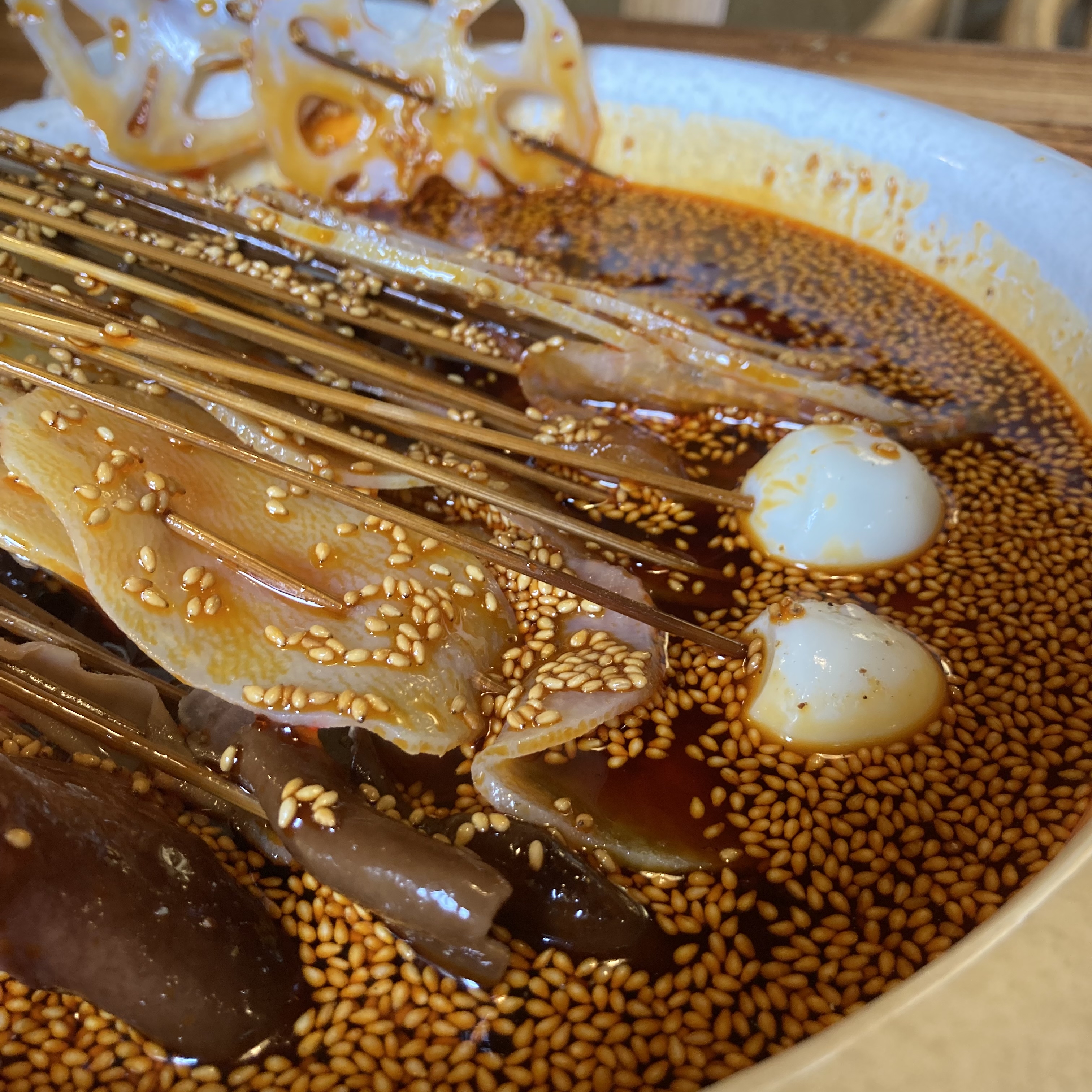 Sichuan Bo Bo Chicken cold skewered chicken in chili oil topped with sesame