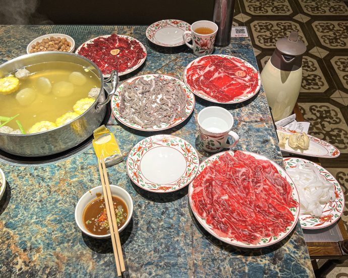 Chaoshan beef hotpot with thin-sliced beef and vegetables in clear broth