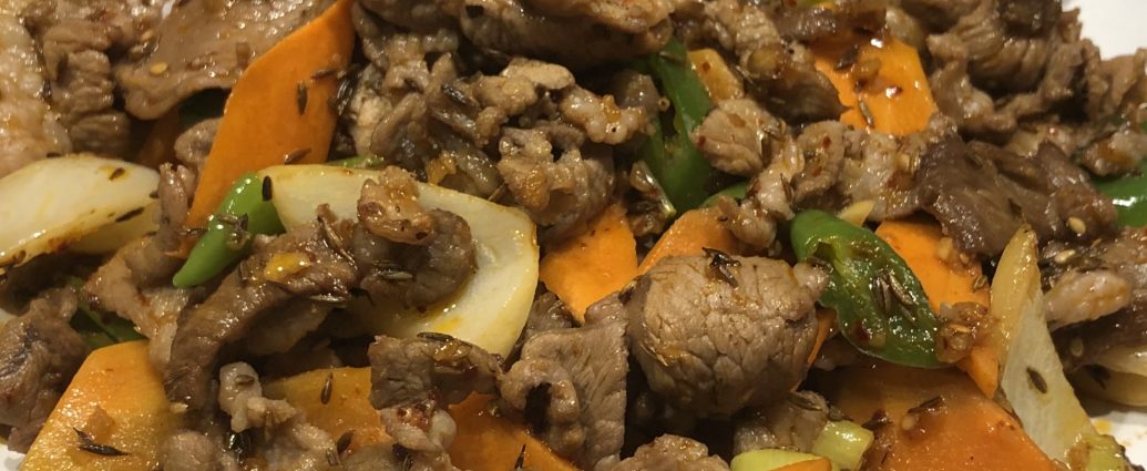 Xinjiang-style cumin lamb stir fry with onions and cumin seeds
