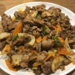 Xinjiang-style cumin lamb stir fry with onions and cumin seeds
