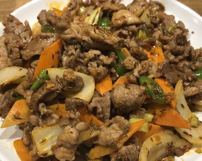 Xinjiang-style cumin lamb stir fry with onions and cumin seeds