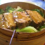 Hunan Fen Zheng Rou steamed pork with rice flour in a bamboo steamer