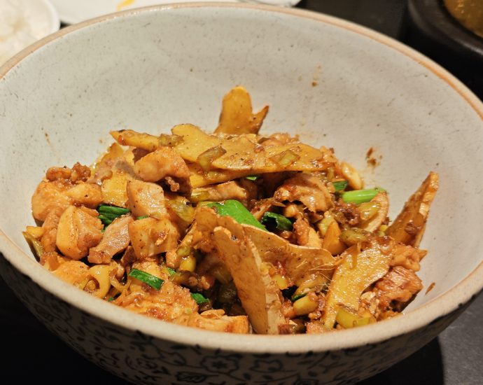 Hunan ginger chicken stir fry with plenty of ginger and green chilies