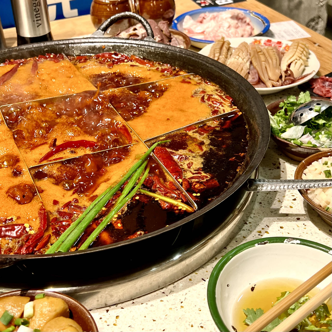 Chongqing nine-grid mala hotpot with spicy red broth bubbling