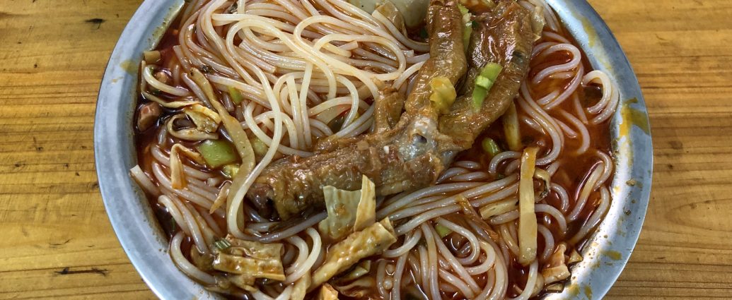 Liuzhou Luosifen rice noodles in spicy snail broth with toppings