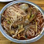 Liuzhou Luosifen rice noodles in spicy snail broth with toppings