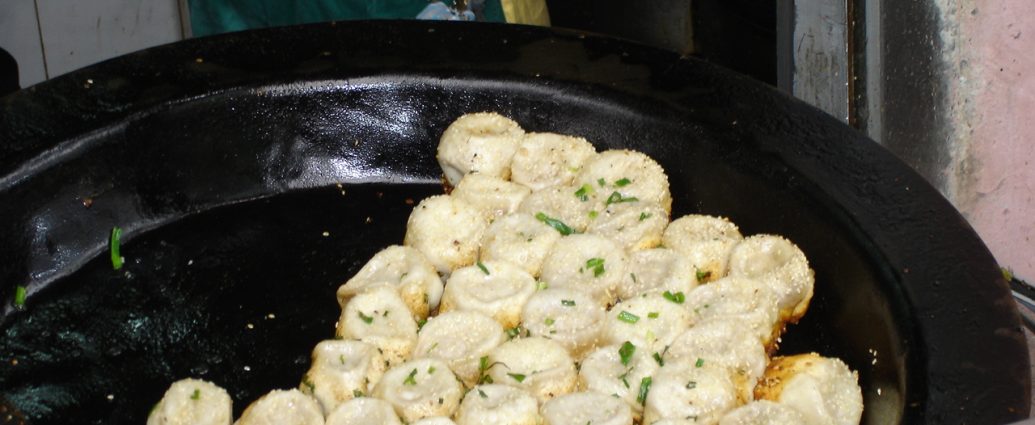 Shanghai Sheng Jian Bao pan-fried pork buns with sesame