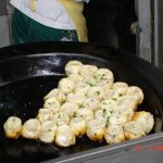 Shanghai Sheng Jian Bao pan-fried pork buns with sesame
