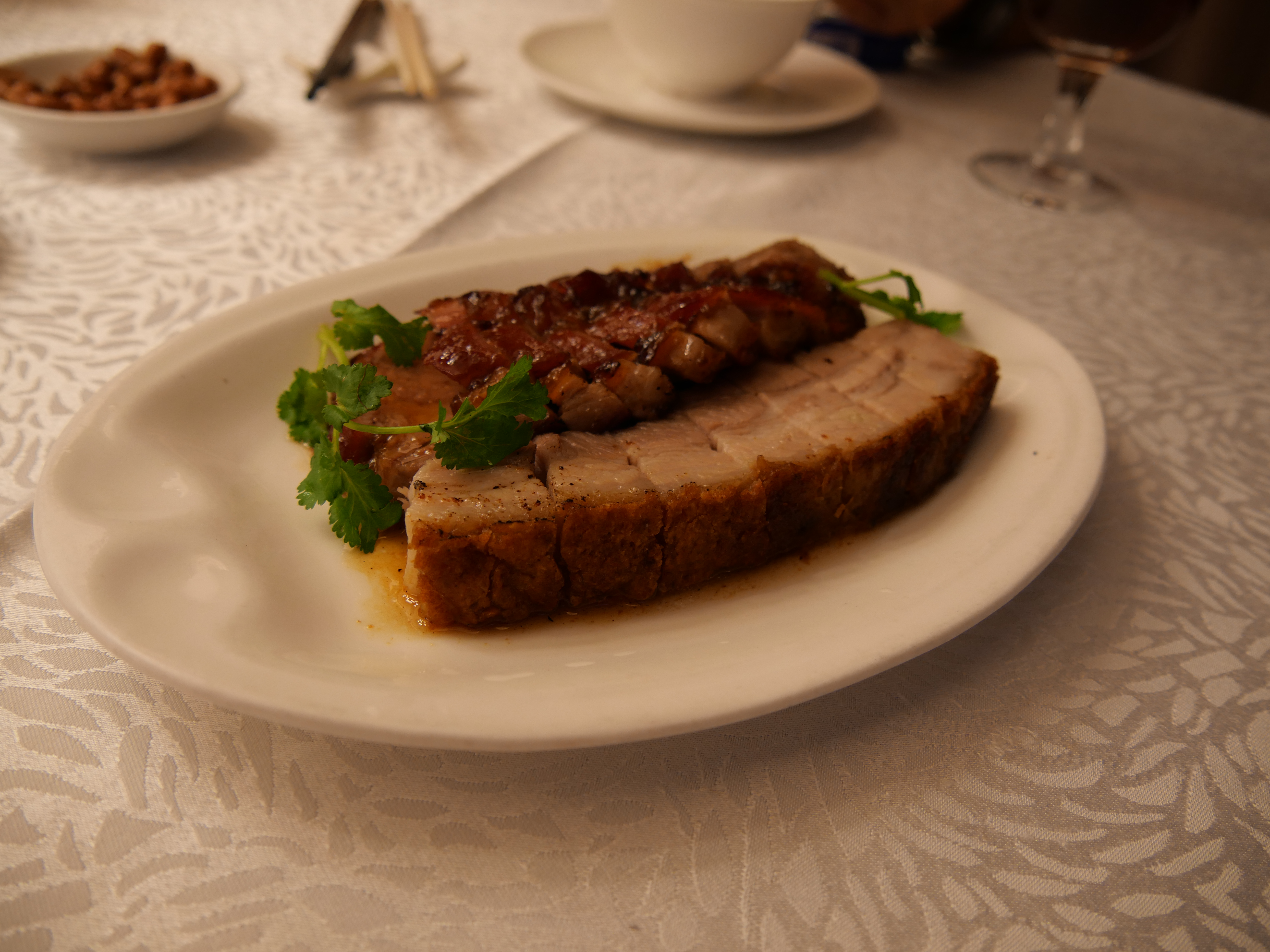 Cantonese Siu Yuk crispy roast pork belly with crackling skin at a barbecue shop