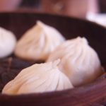 Steamed Shanghai soup dumplings Xiaolongbao in a bamboo steamer