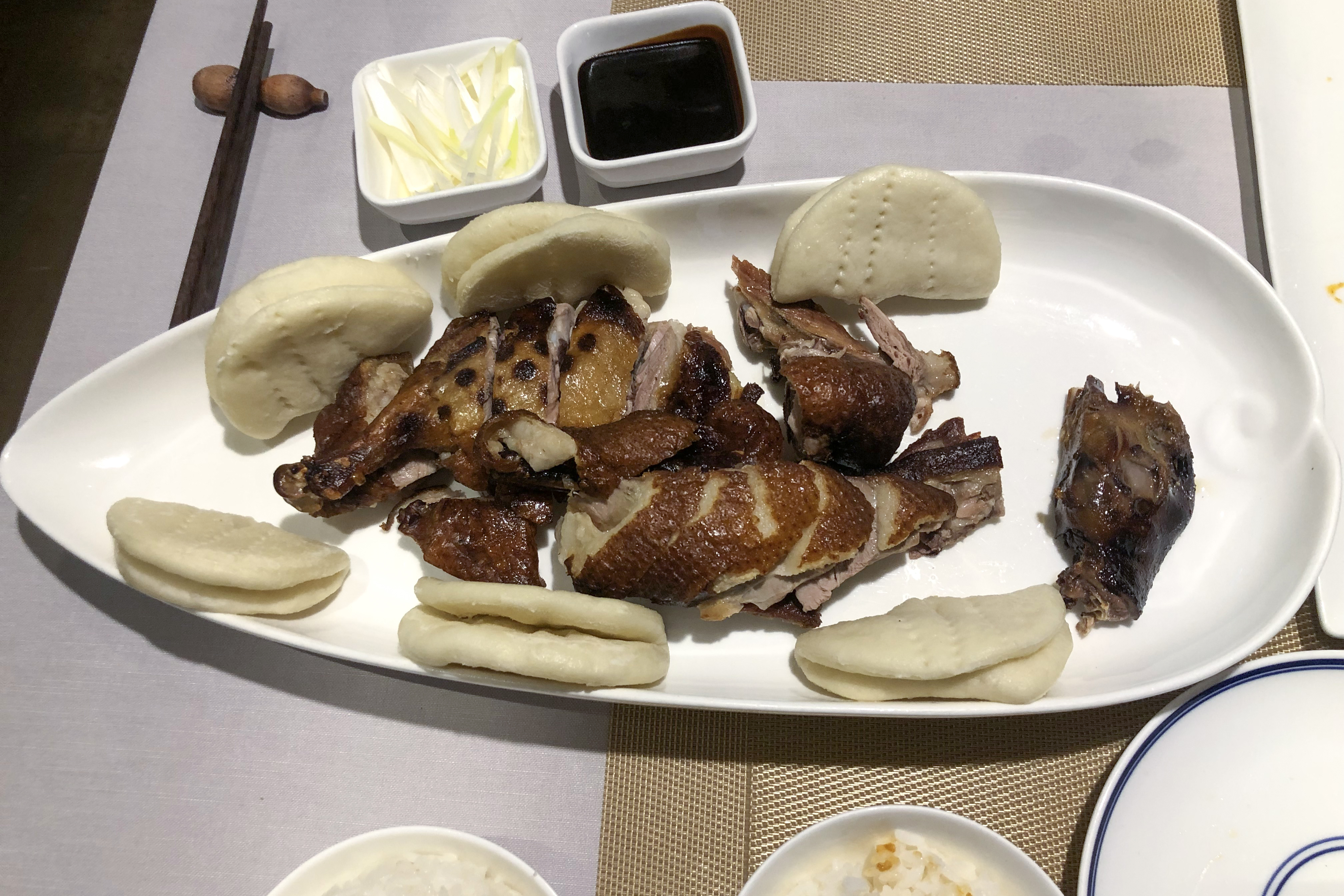 Tea-smoked Sichuan Zhang Cha Duck with lacquered crispy skin served at a Chinese restaurant